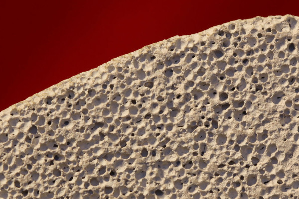 Figure 1: Porosity: Pumice is an example of a rock with high porosity, meaning that it is very porous. Pumice is a type of volcanic rock. It has so much air space in the tiny bubbles within the rock that it will float on water [1].