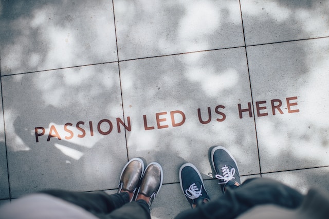 'passion led us here' written on a sidewalk