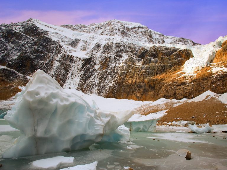 Photograph of Angel Glacier with chunk of ice in the foreground