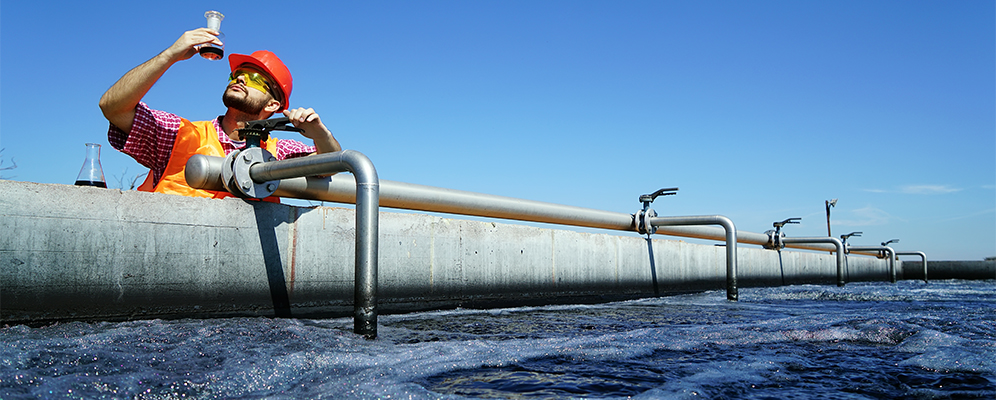 A worker extracting water for industry