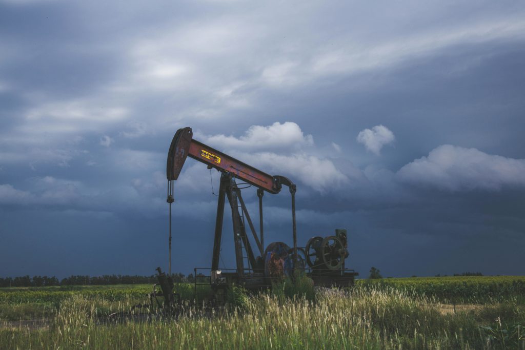 Photograph of a pumpjack in a field