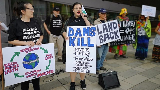 Photograph of people protesting against dam construction.